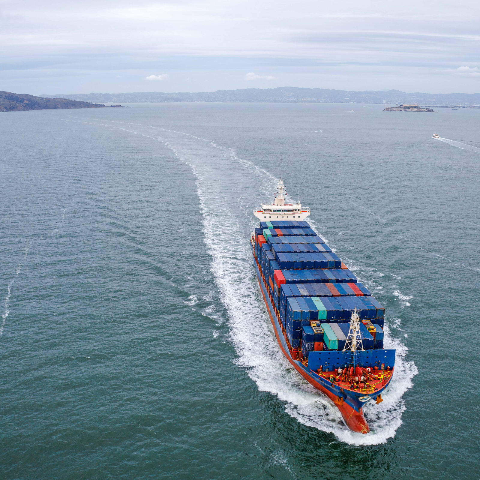 Container ship on the water carrying hardwood flooring